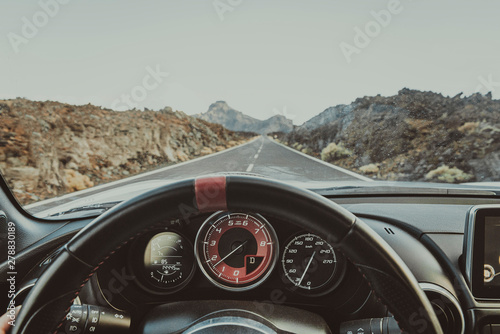 Personal perspective in a car, road Teide National Park, Tenerife, Spain