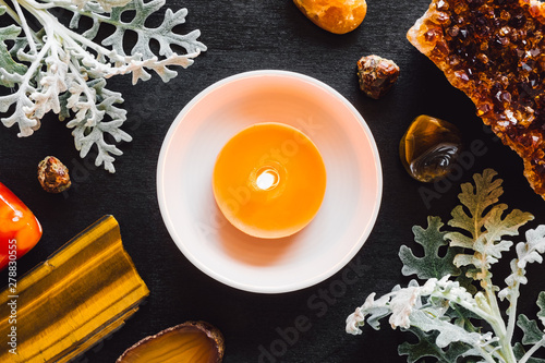 Orange Candle with Stones of the Sacral Chakra