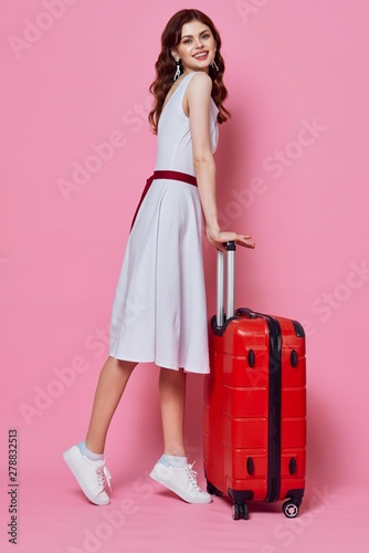 girl in a dress with suitcase