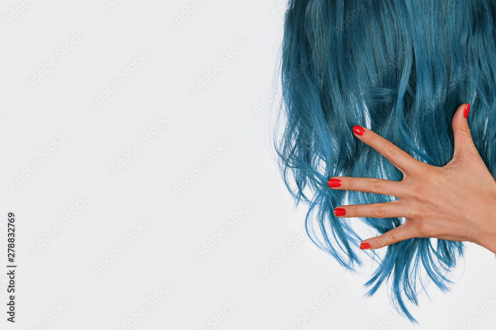 hand holding natural blue hair isolated on white background with copy ...