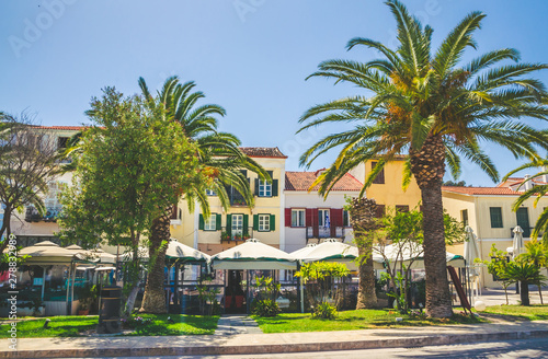 Traditional cozy greek street in city Nafplio, Greece photo