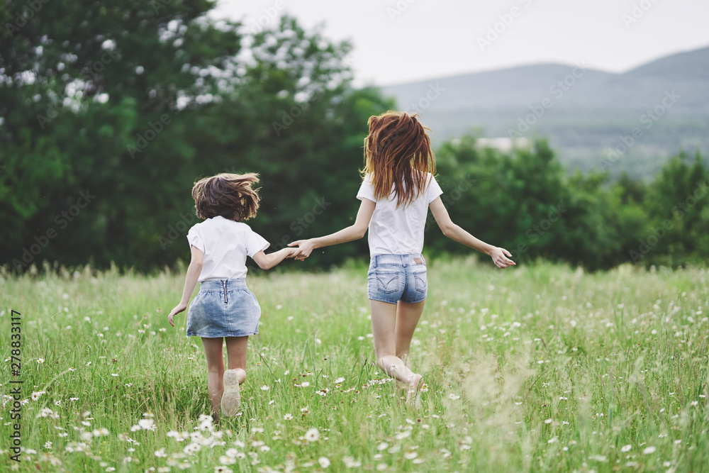 mother and daughter in the field