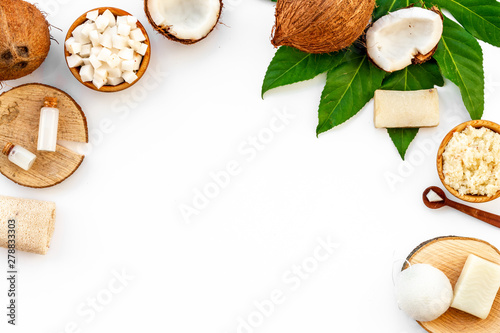 Homemade spa with natural coconut osmetics on white background top view space for text