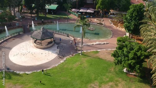 Beautiful summer park with gazebo doves and fountains