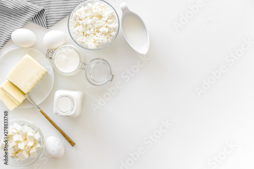 Dairy products from farm with milk, eggs, cottage, butter, yougurt on white background top view mockup