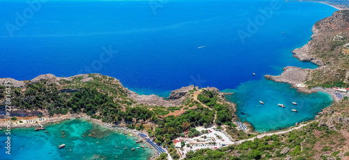 Aerial birds eye view drone photo Anthony Quinn and Ladiko bay on Rhodes island  Dodecanese  Greece. Panorama with nice lagoon and clear blue water. Famous tourist destination in South Europe
