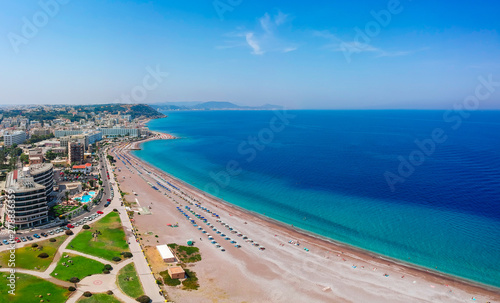 Aerial birds eye view drone photo of Rhodes city island, Dodecanese, Greece. Panorama with nice sand beach, lagoon and clear blue water. Famous tourist destination in South Europe © oleg_p_100