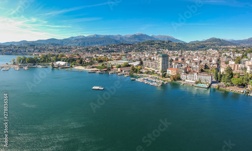 Panorama aerial view of the lake Lugano, mountains and city Lugano, Ticino canton, Switzerland. Scenic beautiful Swiss town with luxury villas. Famous tourist destination in South Europe