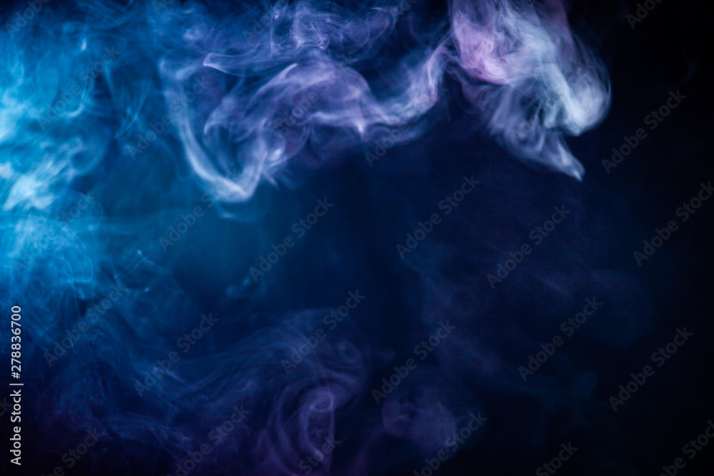 Obraz premium Abstract colorful smoke on black background .