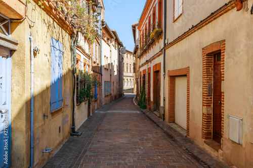 Street in French ancient town Toulouse. Toulouse is the capital of Haute Garonne department and Occitanie region, France, South Europe. Famous tourist destionation.