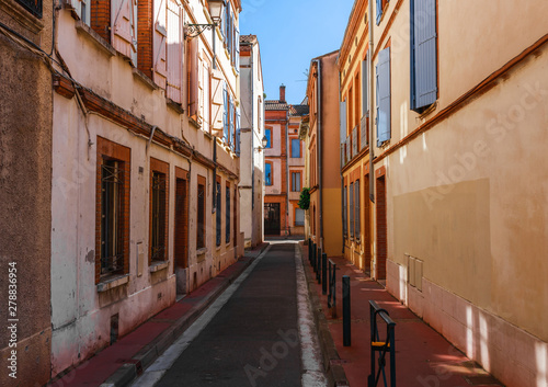 Street in French ancient town Toulouse. Toulouse is the capital of Haute Garonne department and Occitanie region, France, South Europe. Famous tourist destionation.