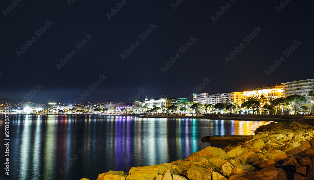 Fototapeta premium Night view Cannes, Cote d'Azur, France, South Europe. Nice city and luxury resort of French riviera. Famous tourist destination with nice beach and Promenade de la Croisette on Mediterranean sea