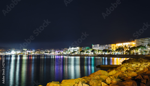 Night view Cannes, Cote d'Azur, France, South Europe. Nice city and luxury resort of French riviera. Famous tourist destination with nice beach and Promenade de la Croisette on Mediterranean sea