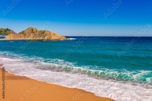 Sea landscape in Blanes, Catalonia, Spain near of Barcelona. Scenic town with nice sand beach and clear blue water in beautiful bay. Famous tourist resort destination in Costa Brava