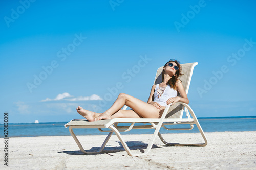 woman in bikini on beach © SHOTPRIME STUDIO