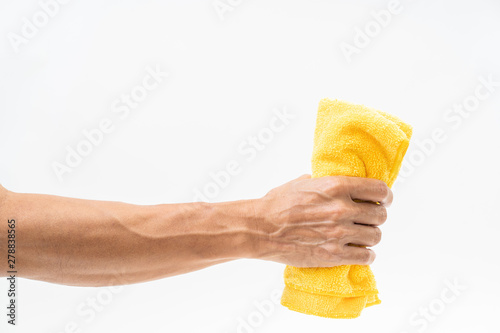 Man hand holding yellow rag on white background