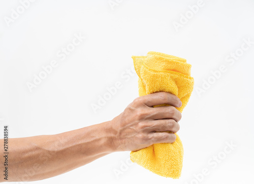 Man hand holding yellow rag on white background