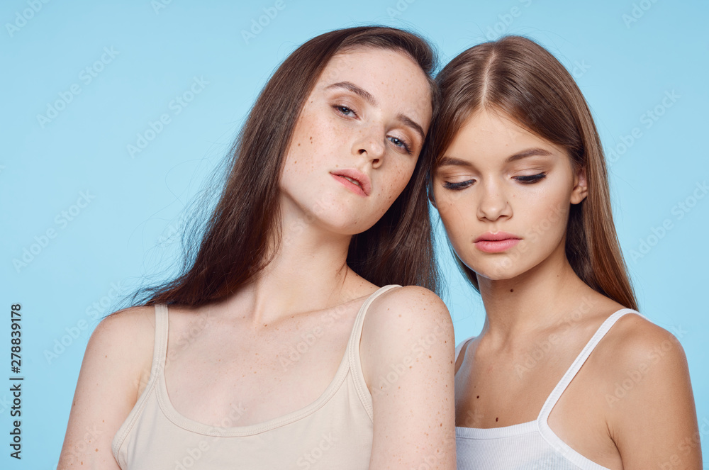 two girls in front of mirror two girls in front of mirror