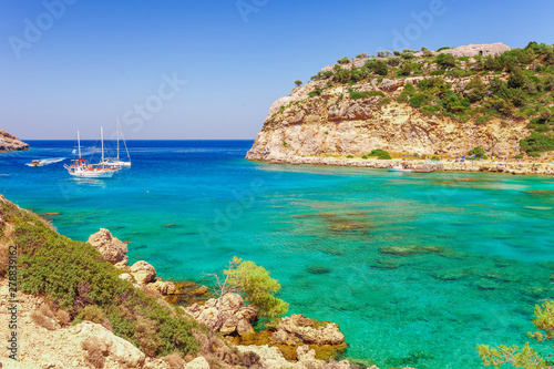 Sea skyview landscape photo Anthony Quinn bay near Ladiko bay on Rhodes island, Dodecanese, Greece. Panorama with nice sand beach and clear blue water. Famous tourist destination in South Europe photo