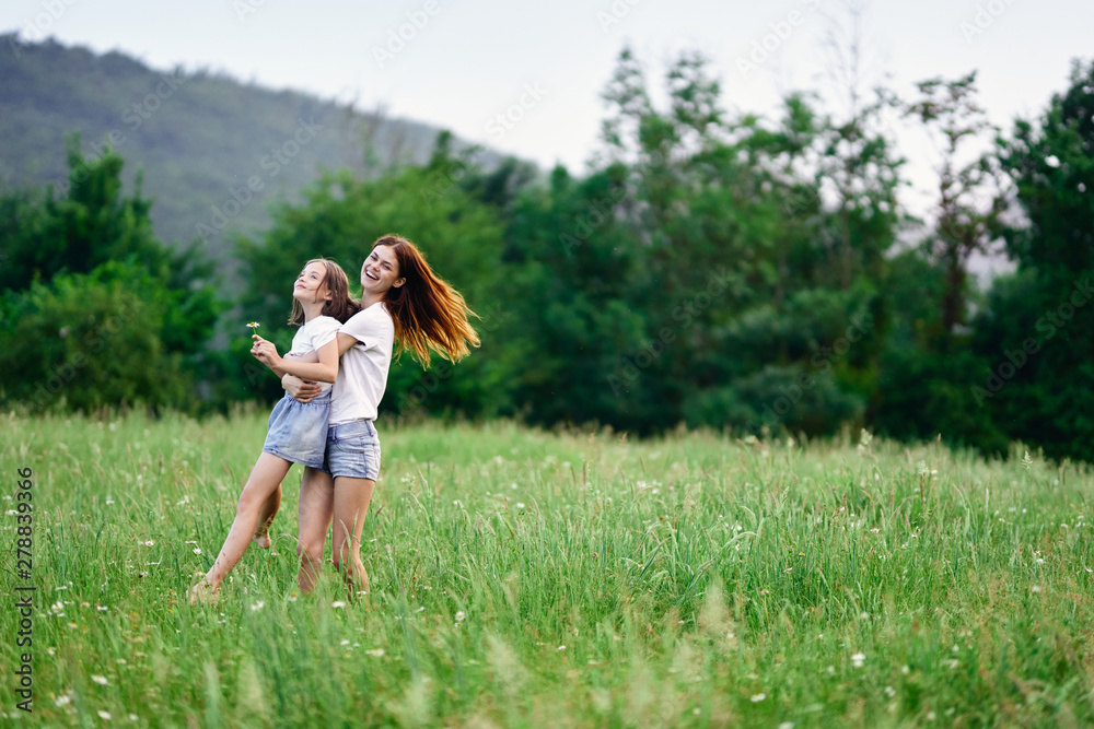 mother and daughter in the field