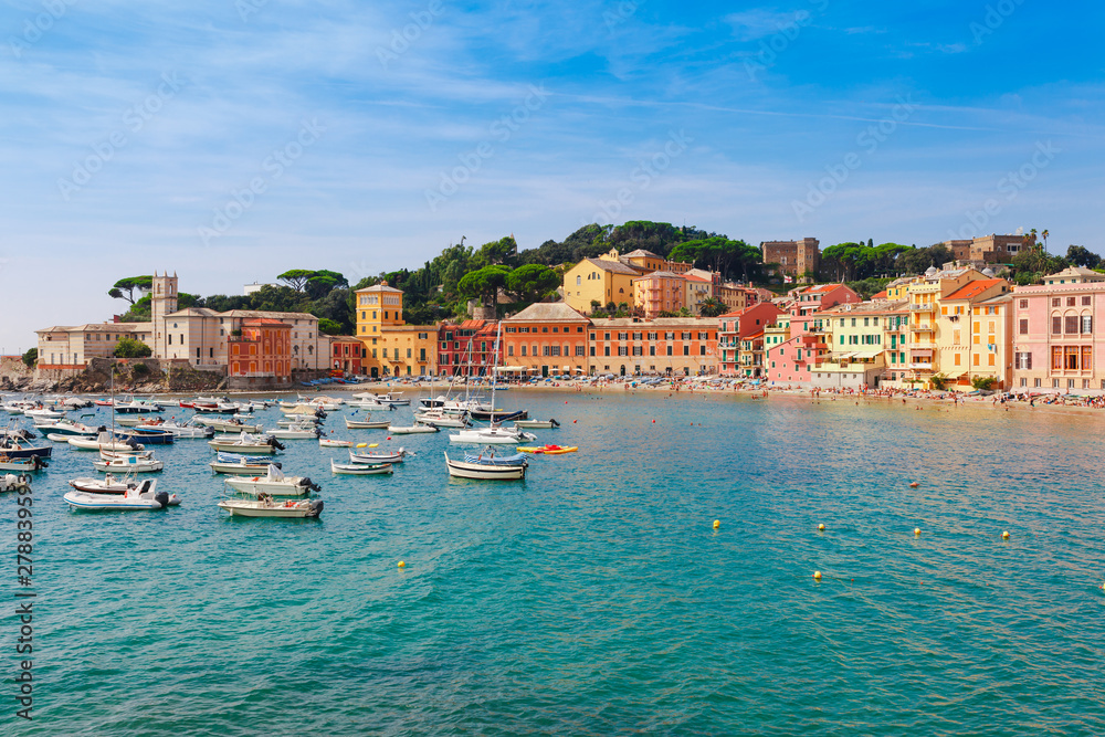 Sea aerial landscape in Sestri Levante, Liguria, Italy. Scenic fishing village with traditional houses and clear blue water. Summer vacation rich resort with picturesque harbour and nice sand beach