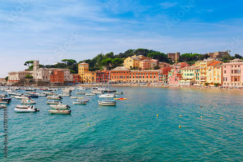 Fototapeta Naklejka Na Ścianę i Meble -  Sea aerial landscape in Sestri Levante, Liguria, Italy. Scenic fishing village with traditional houses and clear blue water. Summer vacation rich resort with picturesque harbour and nice sand beach