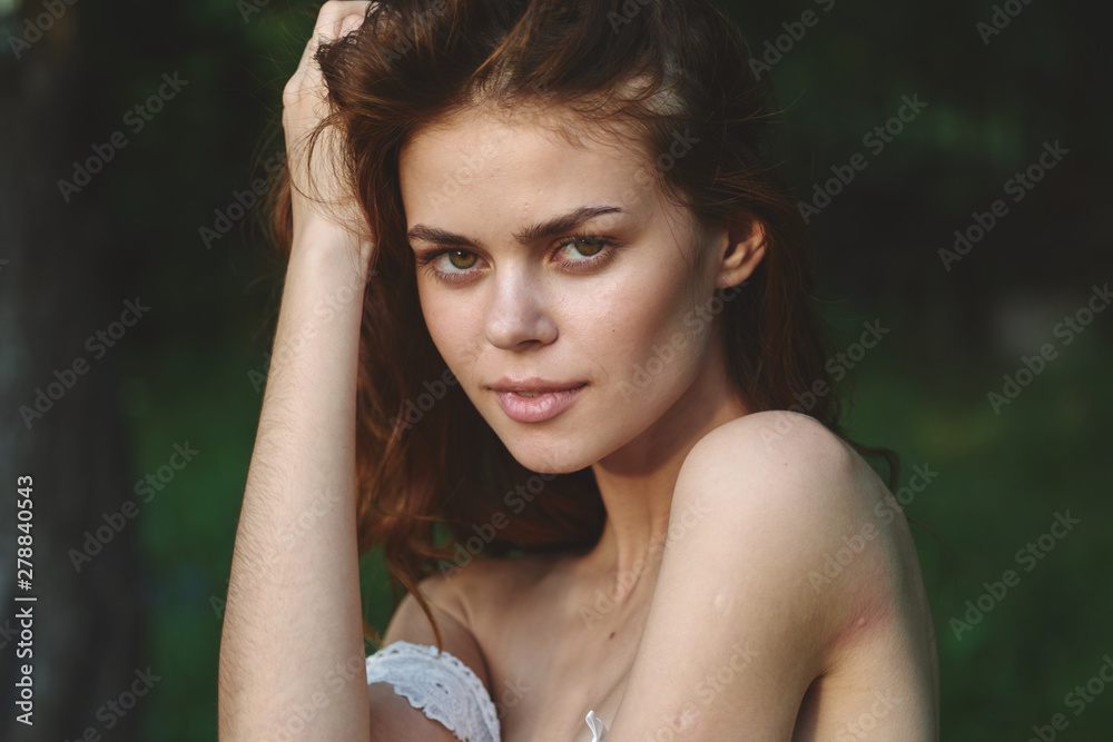 beautiful woman on green leaves park nature beautiful woman on green leaves park nature