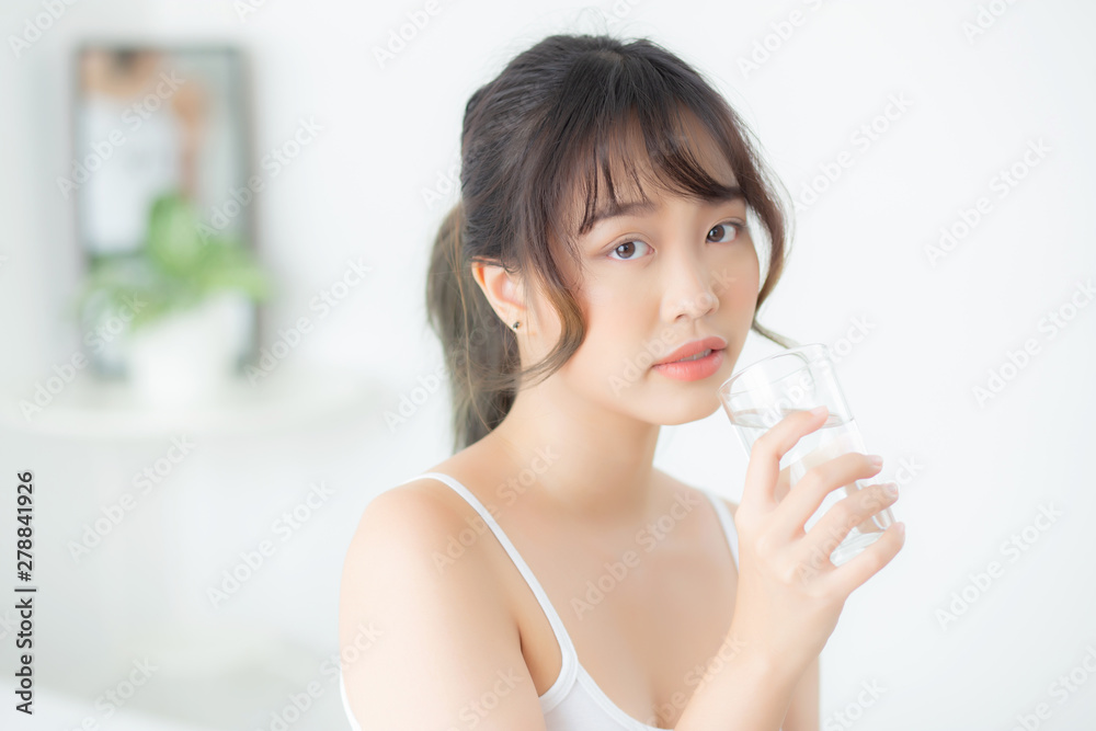 Beautiful portrait young asian woman caucasian smiling with nutrition thirsty and drinking glass of water mineral with fresh and happy, asia girl diet for healthy care and wellness, lifestyle concept. Beautiful portrait young asian woman caucasian smiling with nutrition thirsty and drinking glass of water mineral with fresh and happy, asia girl diet for healthy care and wellness, lifestyle concept.