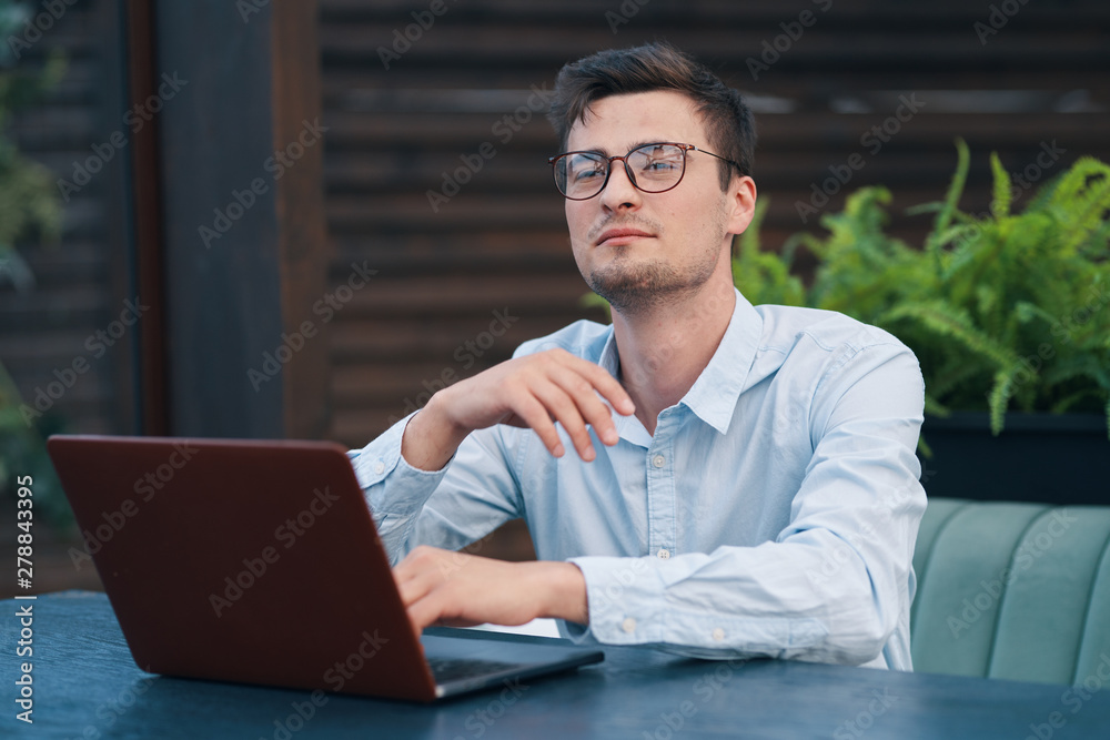 young man working on laptop at home young man working on laptop at home