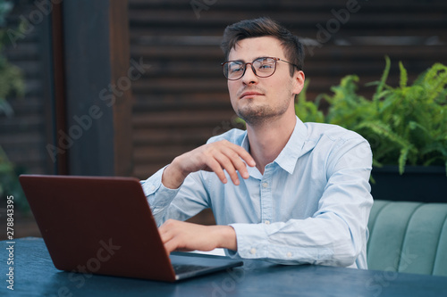 young man working on laptop at home