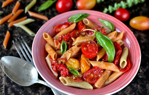  Penne pasta with  cherry tomatoes confit. multicolored cherry