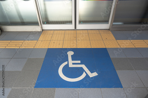 Disable wheelchair sign in public transportation at the floor to enter the train in Japan, important and care of disable in developed country