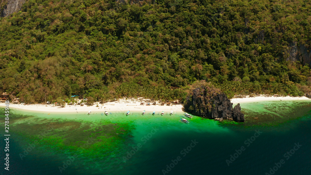 Tropical beach and clear blue water. El nido, Philippines, Palawan. Seascape with tropical rocky islands, ocean blue water. Summer and travel vacation concept