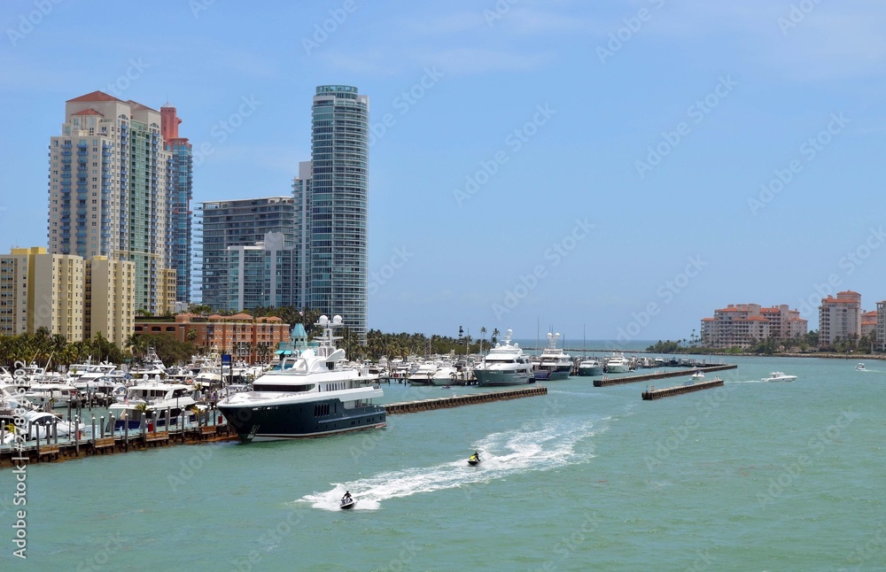 Luxury Condominium Towers Overlooking Luxury Yachts moored at a marina in Southeast Florida