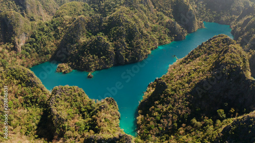 Aerial drone Kayangan lake with blue water on tropical island Coron. Lake in the mountains covered with tropical forest. Palawan, Philippines