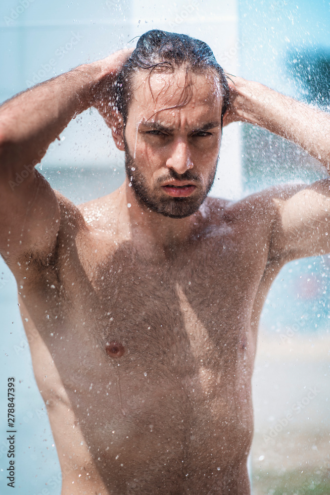 Attractive young guy taking a shower Attractive young guy taking a shower