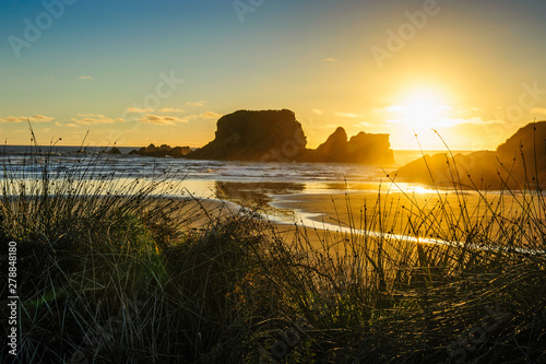 Sunset at Cape Foulwind near Westport, South Island, New Zealand photo