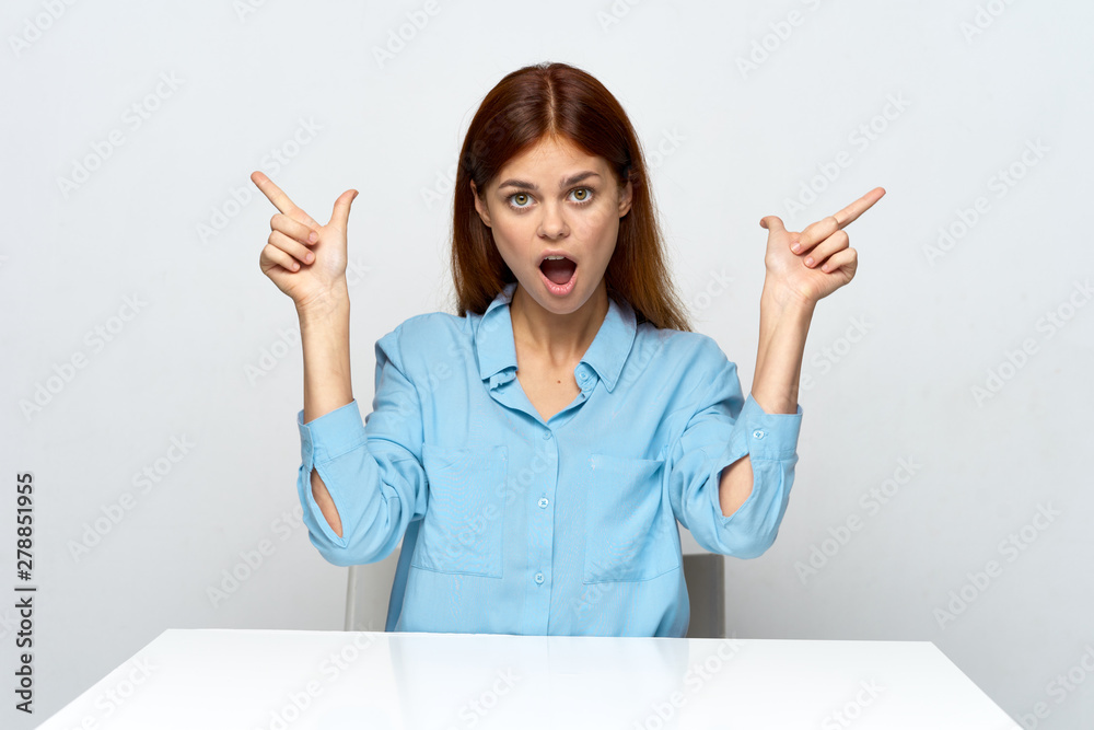 young woman pointing at copyspace young woman pointing at copyspace