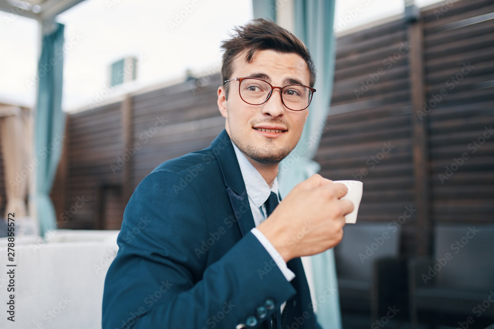 portrait of a businessman in front of office building portrait of a businessman in front of office building