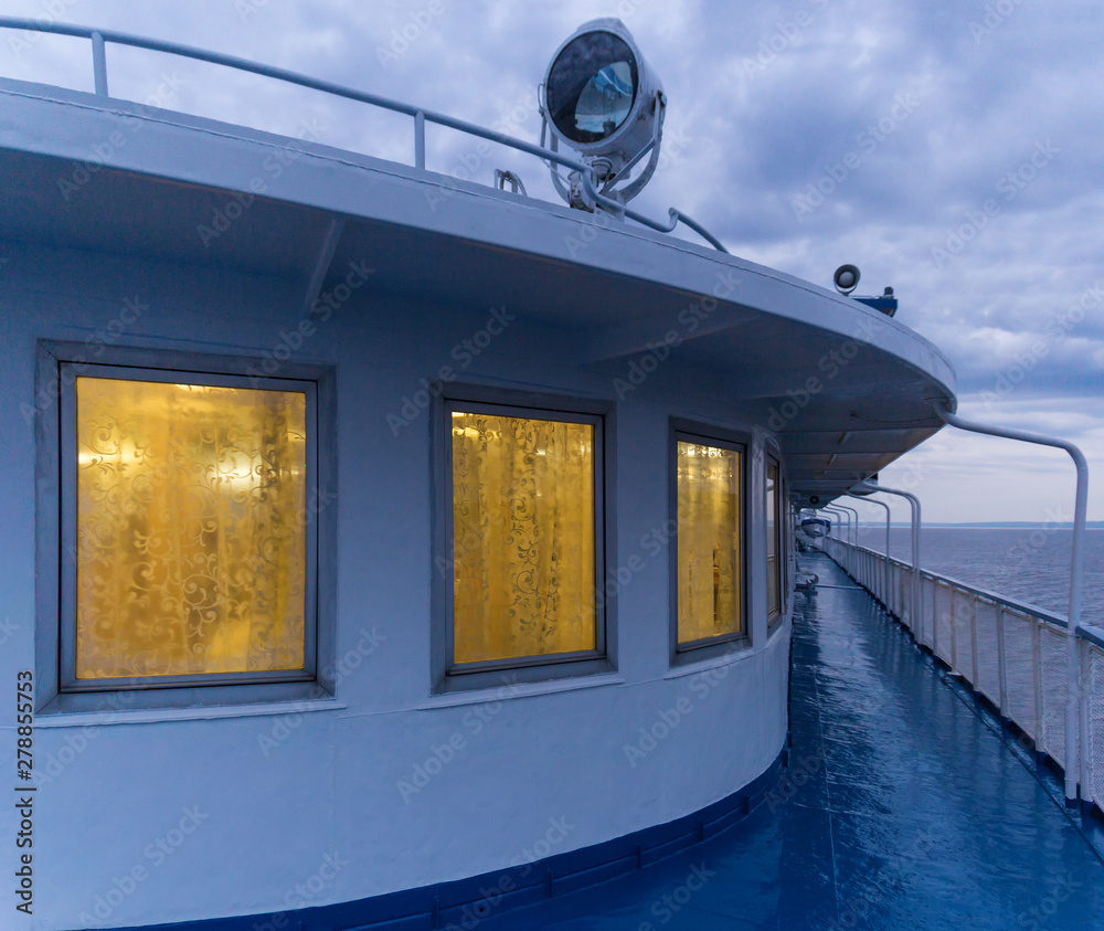 Deck of a passenger ship with luminous windows Deck of a passenger ship with luminous windows