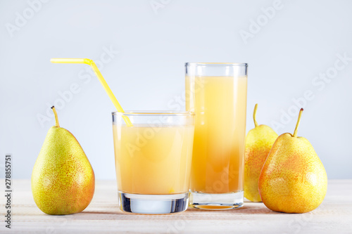 Pear Juice with fresh fruits on wooden table. Healthy food and drink.