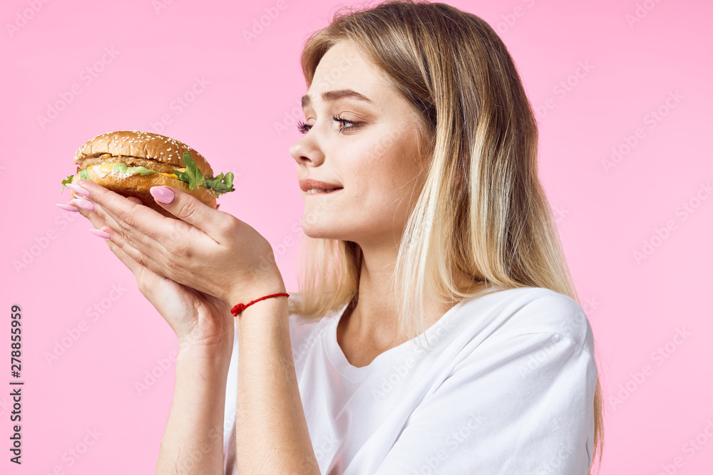 woman eating hamburger