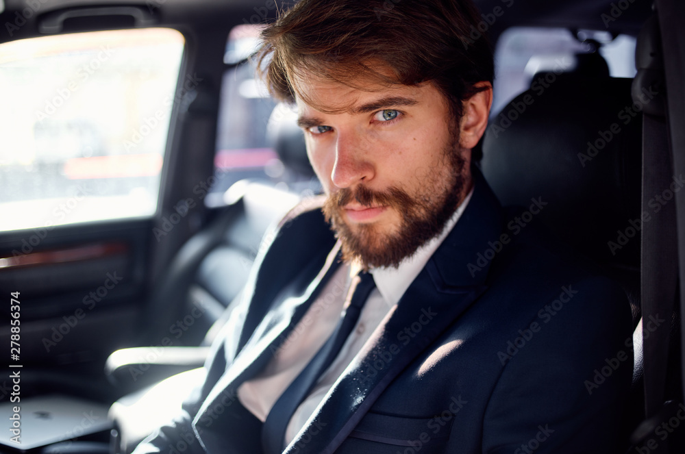 portrait of businessman in car