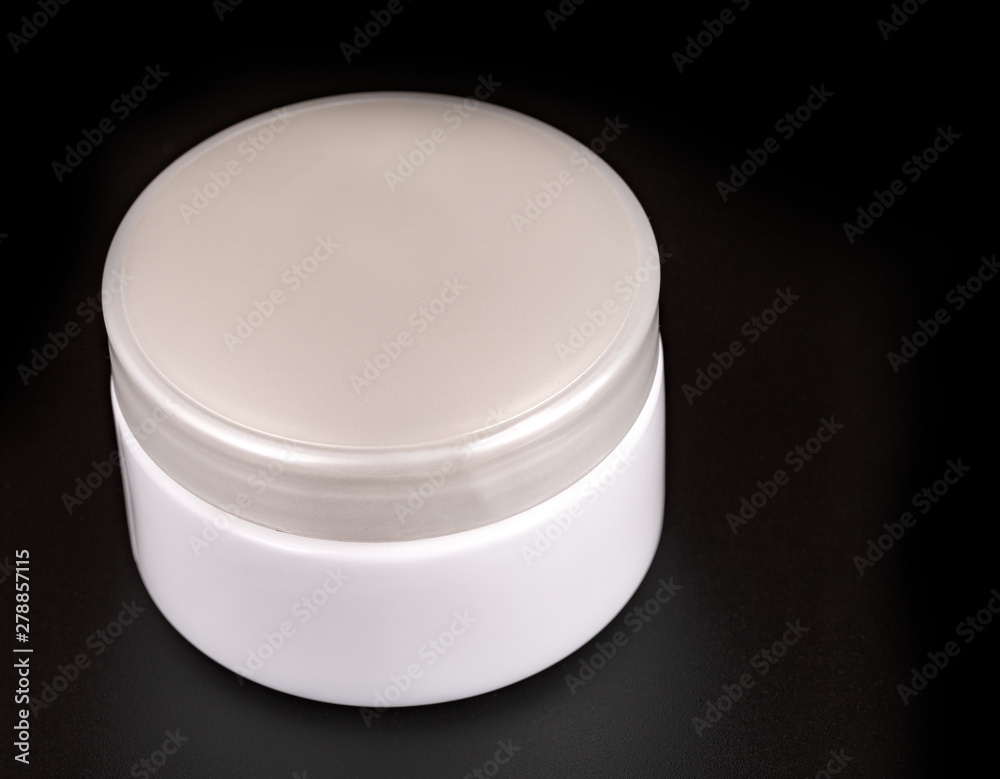 The Beauty Cream Containers on Black Background The Beauty Cream Containers on Black Background