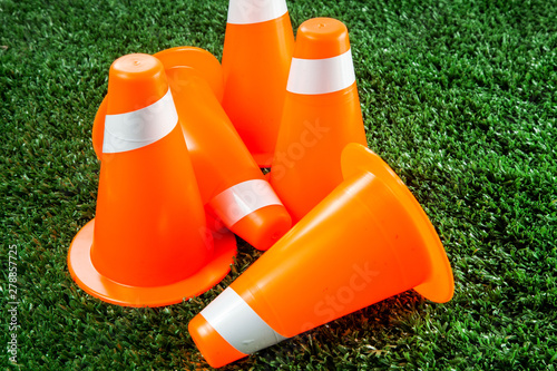 Soccer tactics on grass field with cone for training