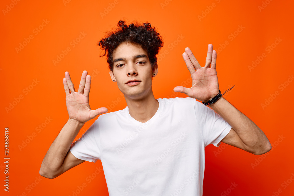 young man with arms raised young man with arms raised