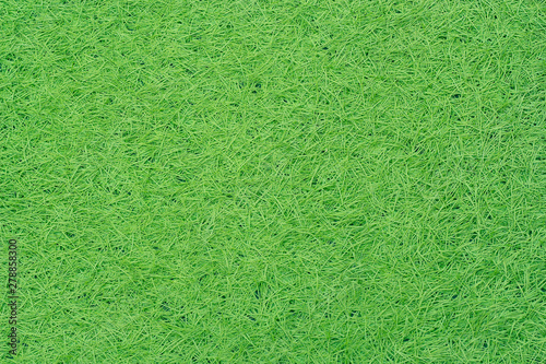 Green fake grass texture or background and copy space