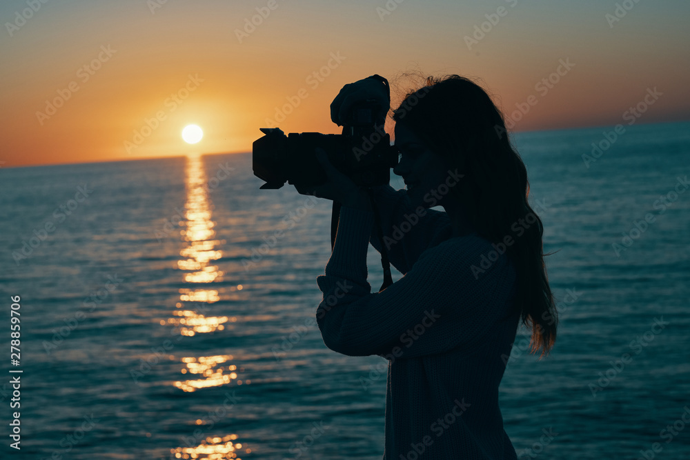 silhouette of photographer at sunset