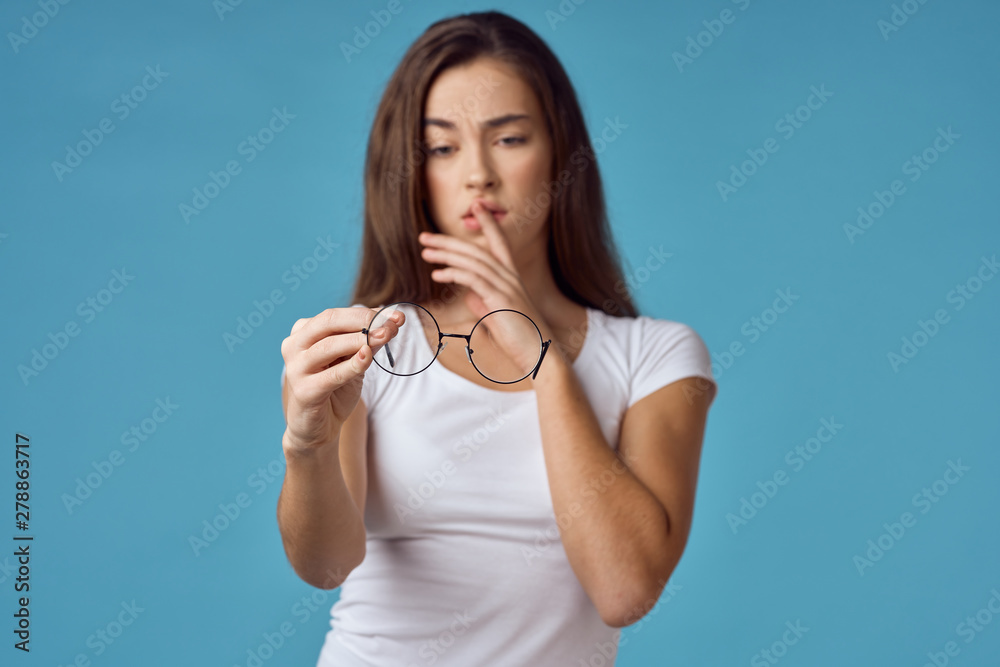 portrait of a young woman with finger on her lips portrait of a young woman with finger on her lips
