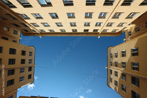 Blue sky on the top of famous well yards of Saint Petersburg, Russia